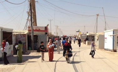 Walking along the ‘Champs Elysees’, the main street in the Zaatari refugee camp for Syrian refugees in Jordan / Photo by the FCO